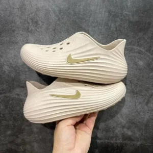 Nike Beige Gold Logo Sneakers: Modern